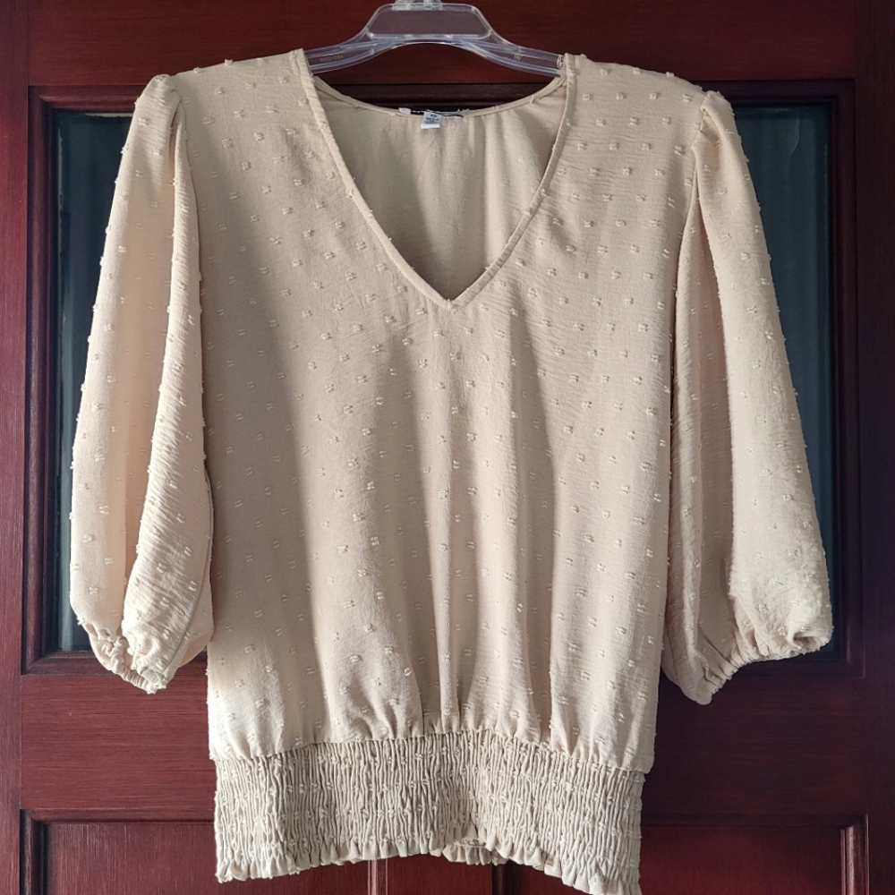 Flowy puff sleeve textured cream peplum blouse top
